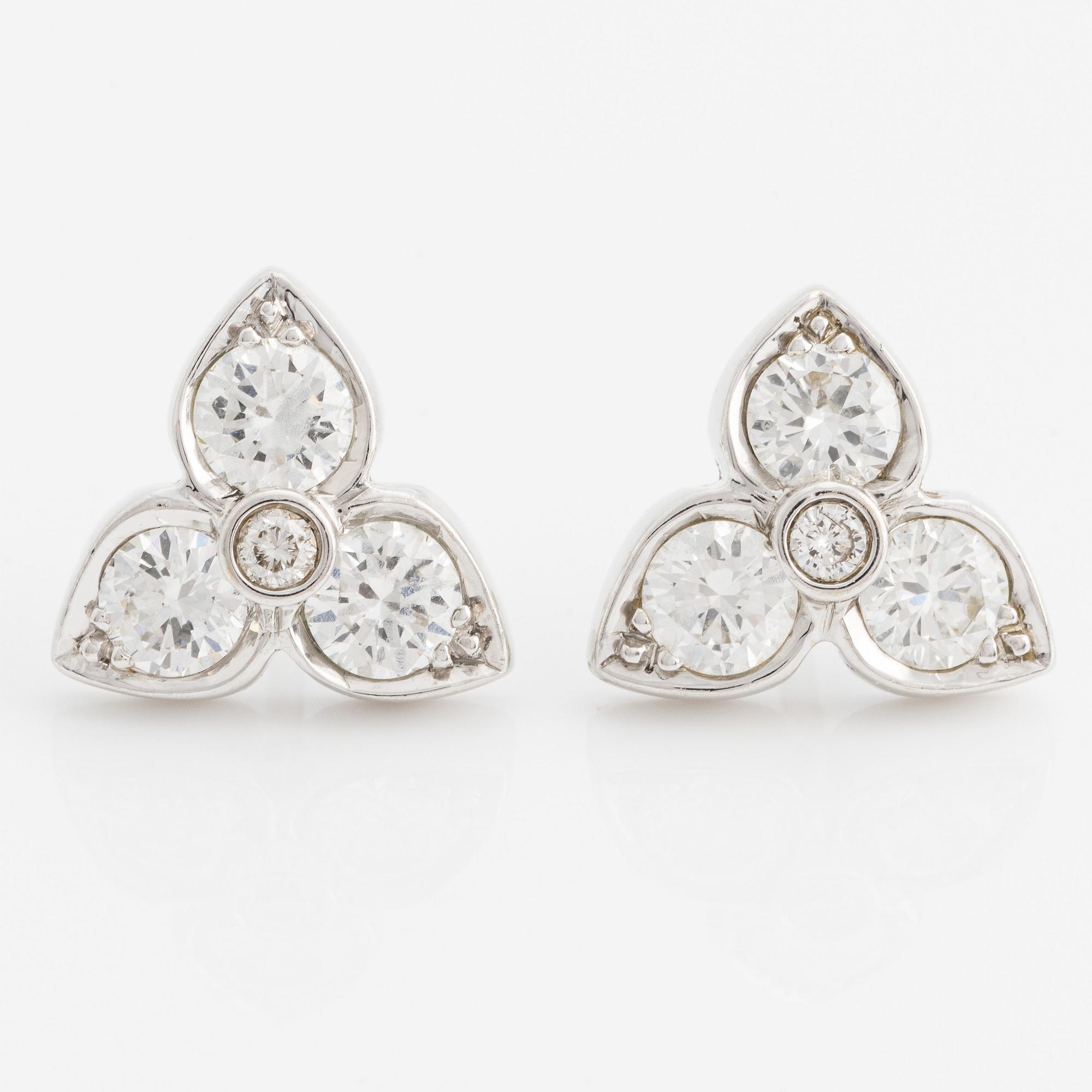 A pair of 18K white gold earrings with round brilliant-cut diamonds.