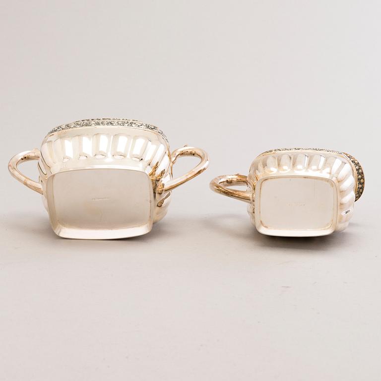 JUHO TEPPONEN, a lidded sugar bowl and a cream jug in silver with gilt interior, Helsinki 1936.