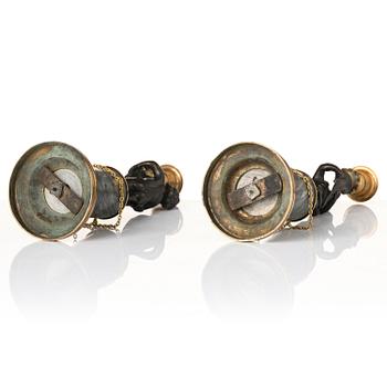 A pair of French Louis XVI ormolu and marble candlesticks, late 18th century.