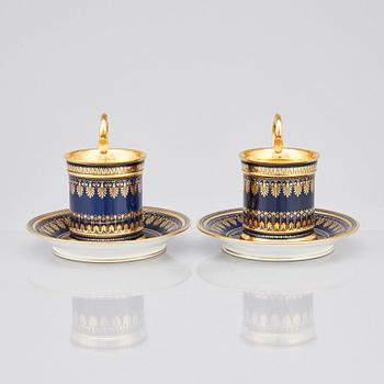 A pair of Sèvres cups with stands, 19th Century.