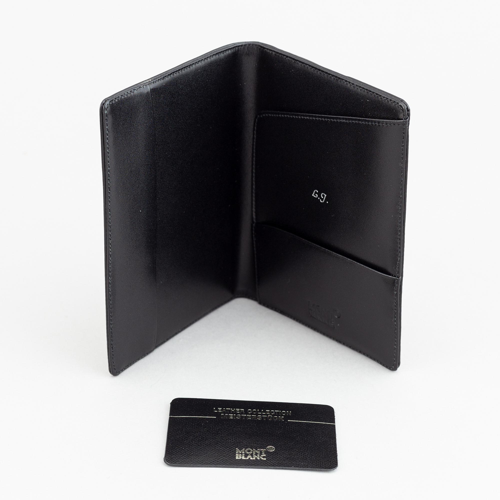 MOntblanc, a ball point pen and leather passport holder.
