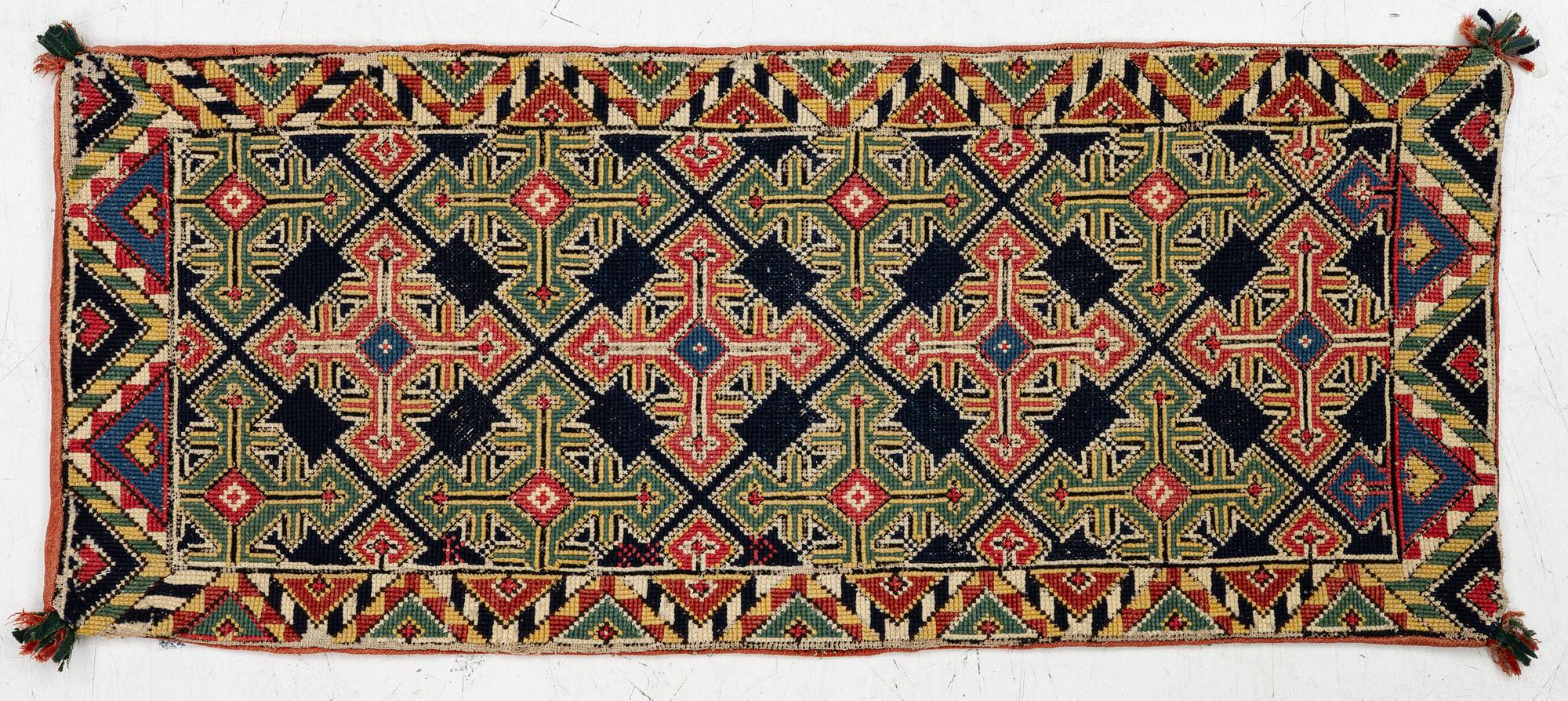 An embroidered carriage cushion, c. 98,5 x 41 cm, South West Scania, circa 1800-1830.
