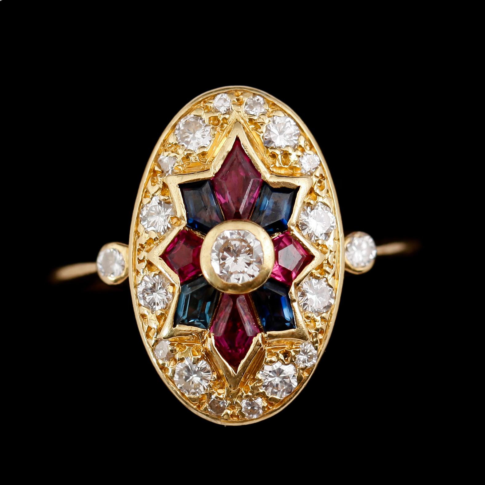 RING, 18 k guld, carréslipade rubiner och safirer, diamanter totalt 0.69 ct. Vikt ca 5 g.