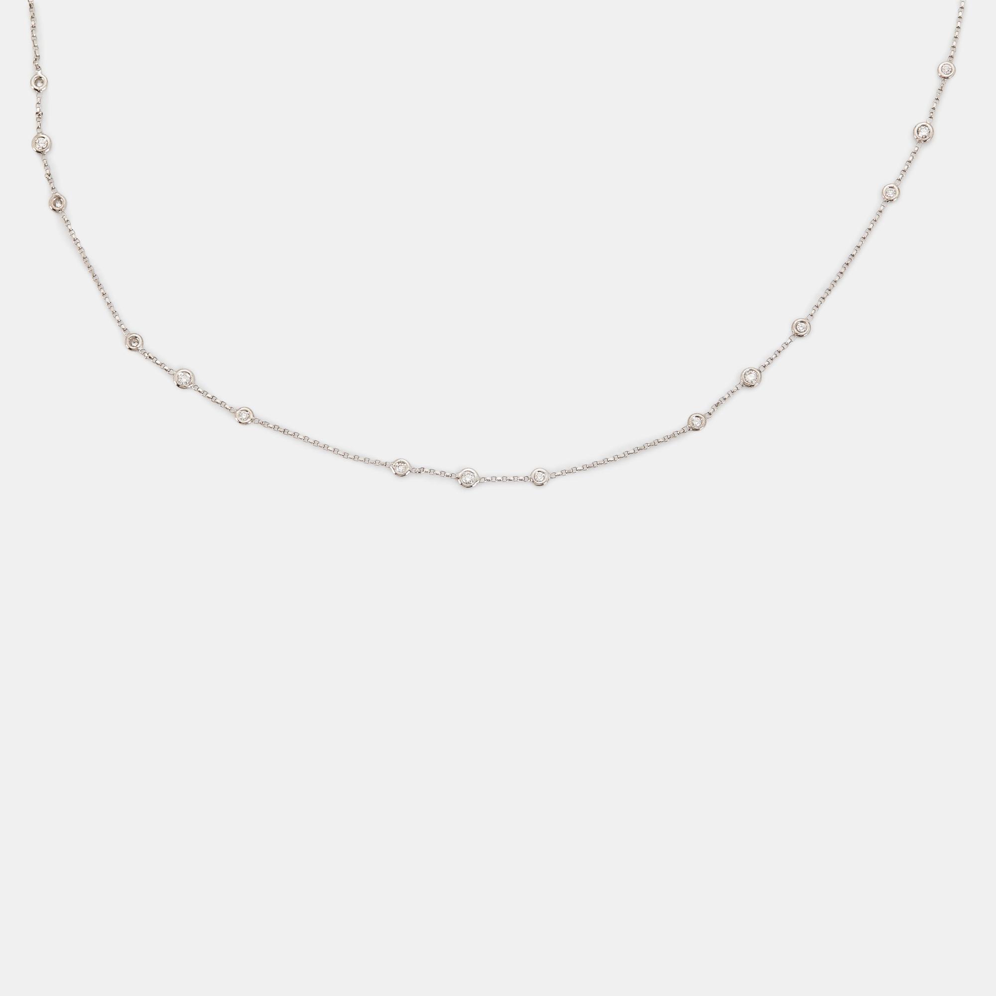 A diamond long chain in 18K white gold set with round brilliant-cut diamonds.