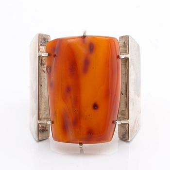 BANGLE, silver w amber, hinge mechanism, widest part approx 7 cm.
