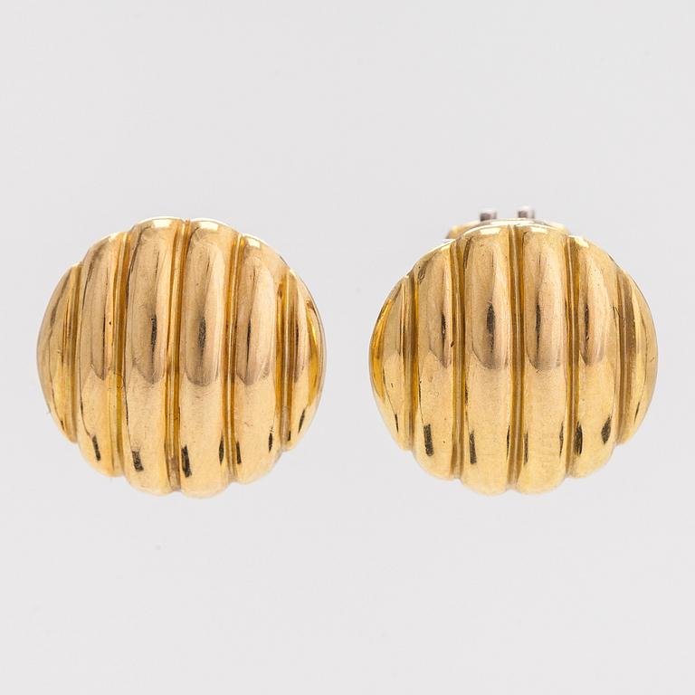 A pair of 18K gold earrings.