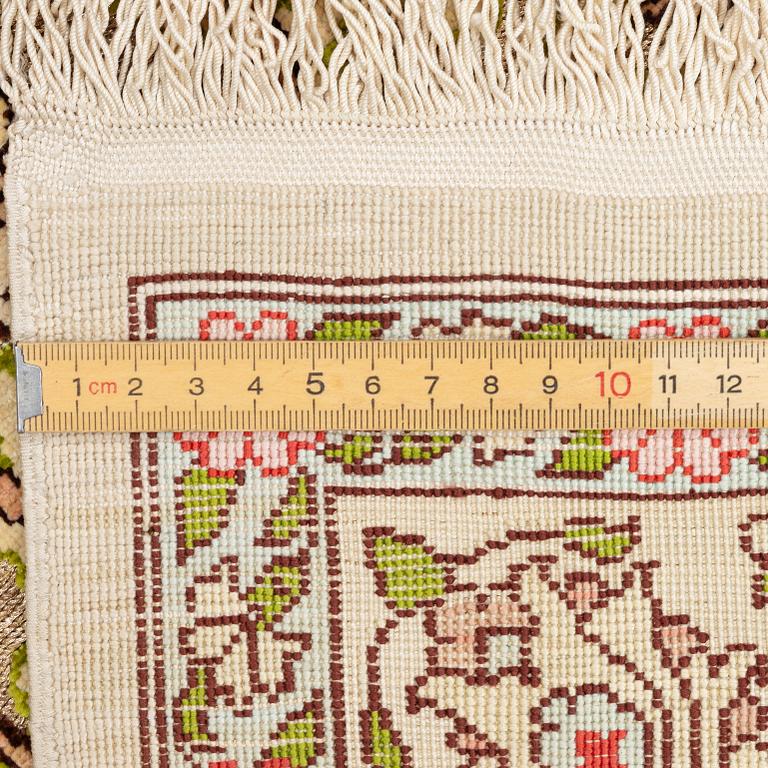 A silk an metal Hereke rug, West Anatolia, c. 100 x 68 cm.