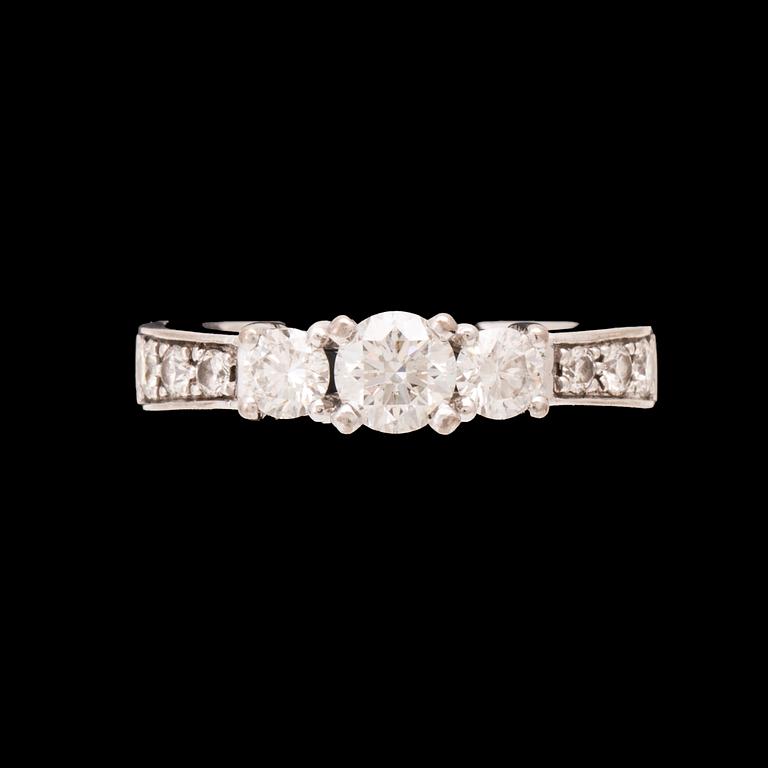 An 18K white gold ring set with round brilliant cut diamonds.