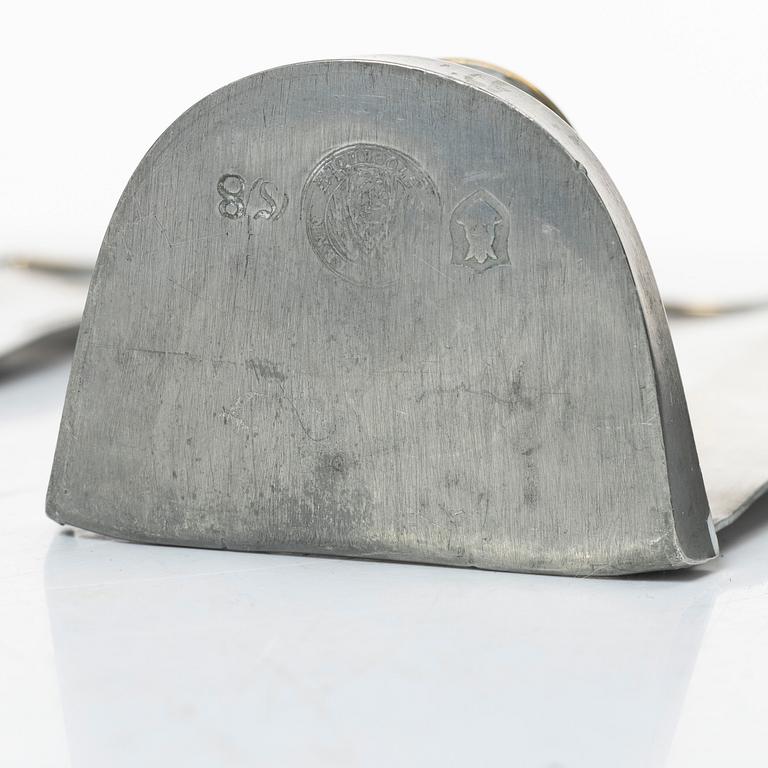 Nils Fougstedt, a matched pair of pewter and brass wall sconces, model A 60, Svenskt Tenn, Stockholm 1929 and 1932.