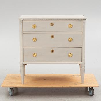 A Gustavian style chest of drawers, mid 20th century.