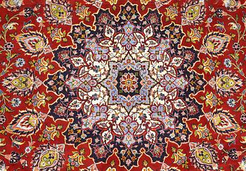 A Keshan carpet, part silk, signed, approx. 398 x 270 cm.