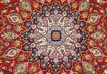 A Keshan carpet, part silk, signed, approx. 398 x 270 cm.