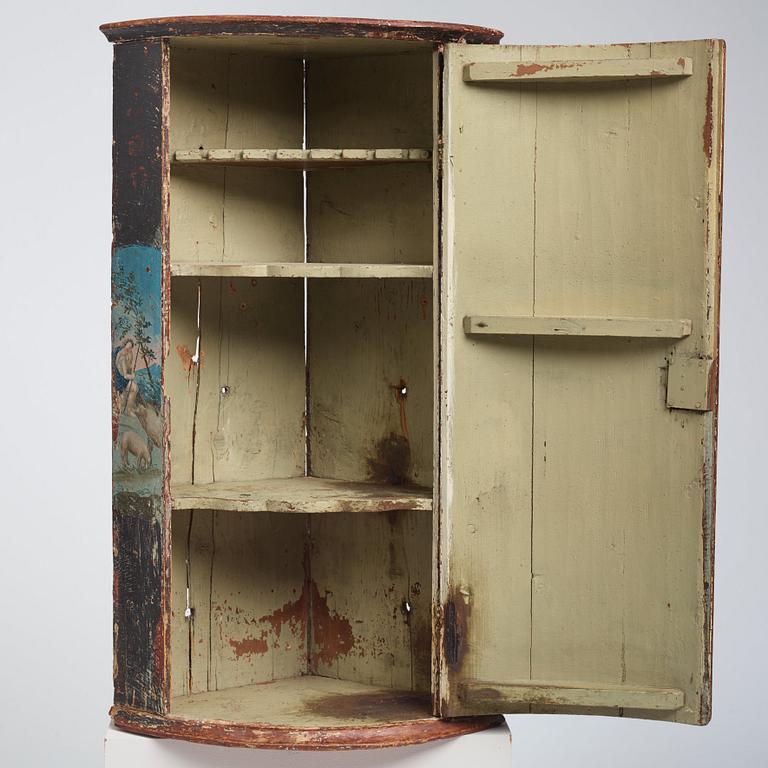 A Swedish late Baroque polychrome-painted corner cabinet, mid 18th century.