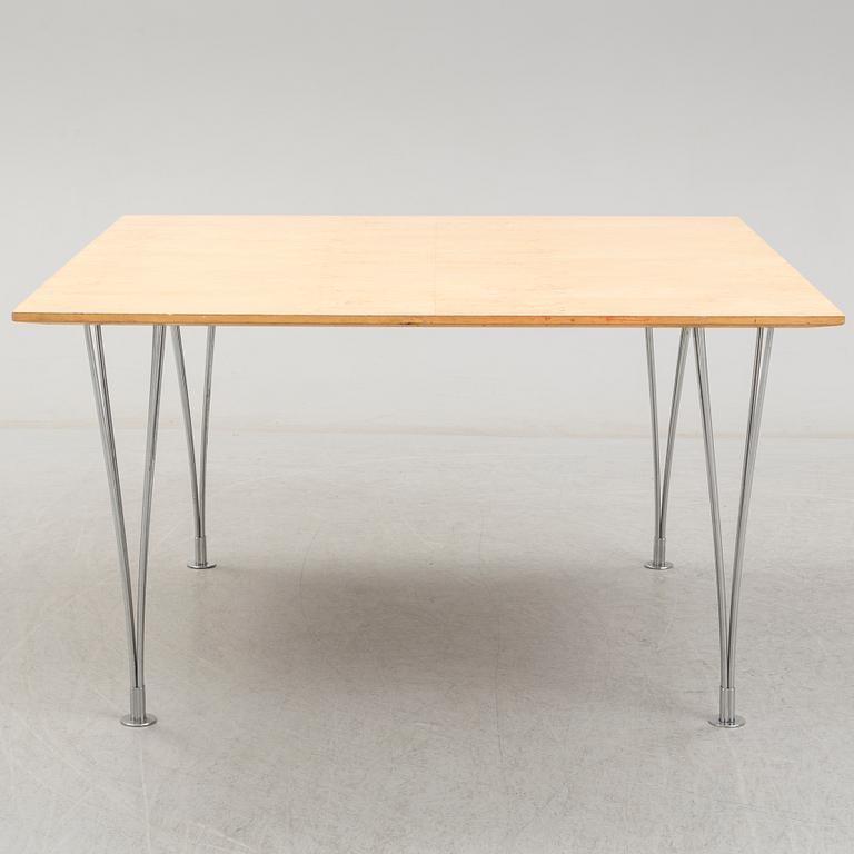 A birch veneered dining table by Bruno Mathsson and Piet Hein.