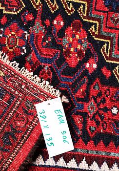 A Hosseinabad carpet, c. 391 x 135 cm.