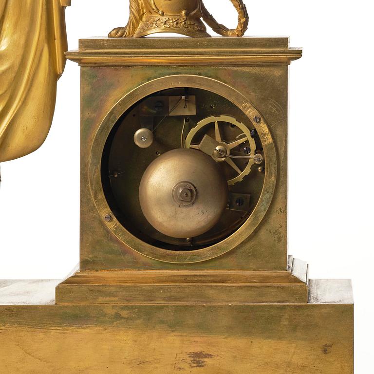 A French Empire figural ormolu mantel clock, early 19th century.
