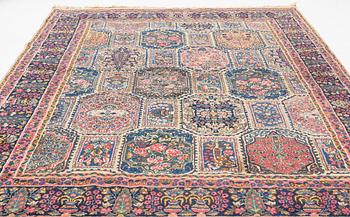 An carpet, possibly Kirman, signed, 350 x 255 cm.