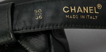 A black quilt leather bumbag by Chanel.