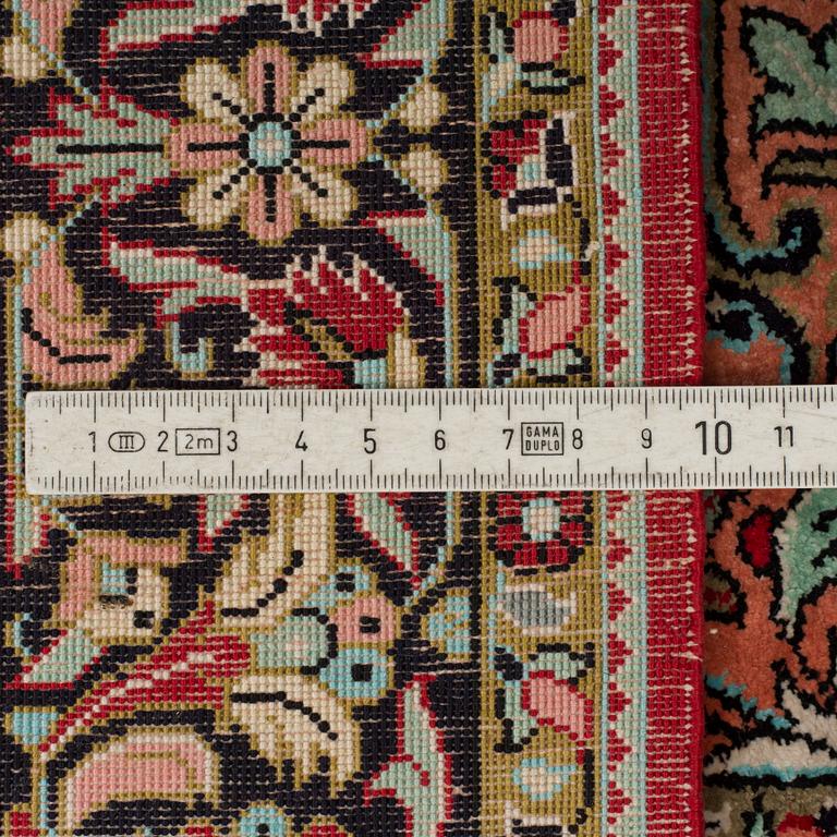 A silk Qum rug, around 114 x 80 cm.