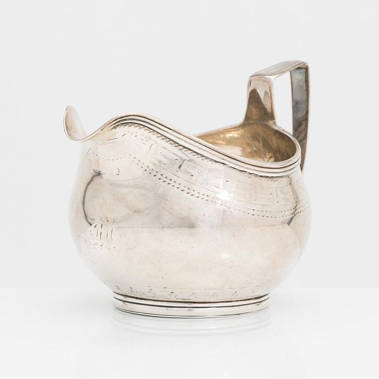 A Georgian sterling silver jug, late 18th century. Worn marks.