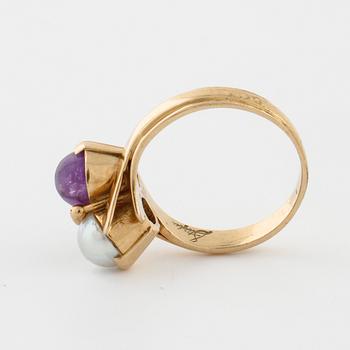 A cultured pearl and cabochon cut amethyst ring by  Stigert, Stockholm, 1955.