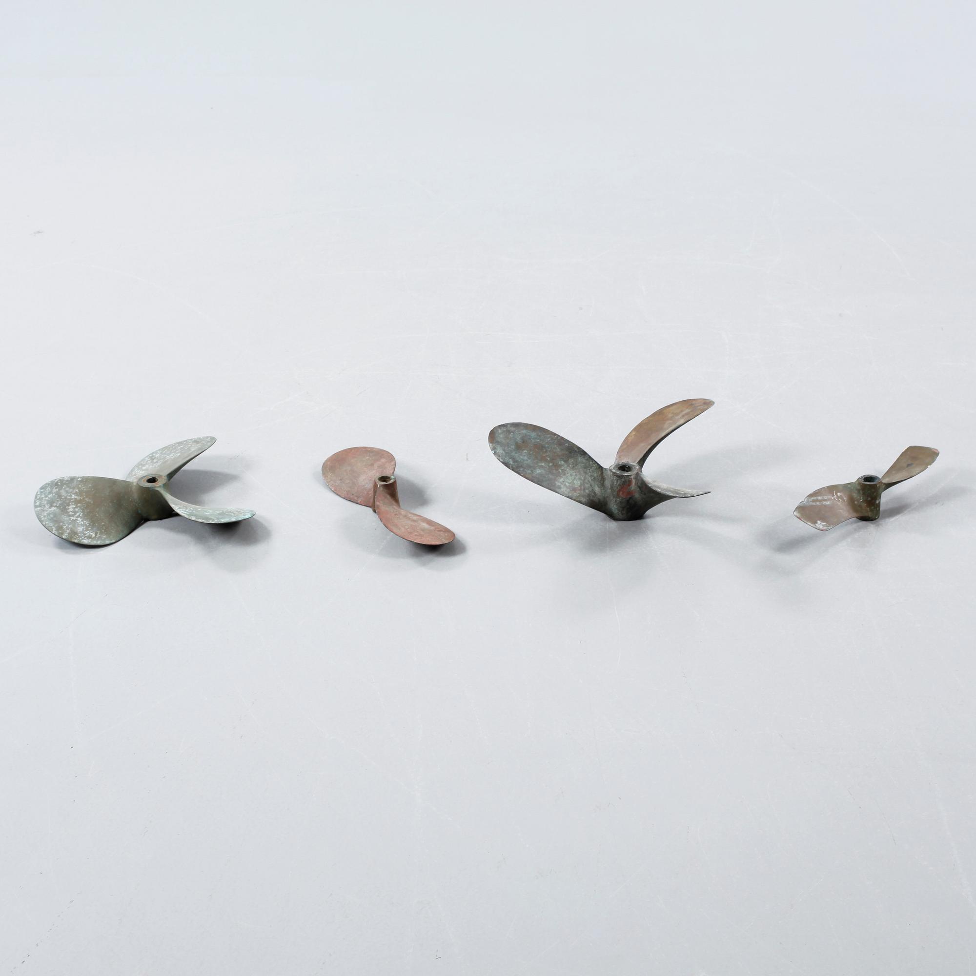 Four 20th century bronze propellers.