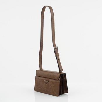 Prada, a brandy colored bag.