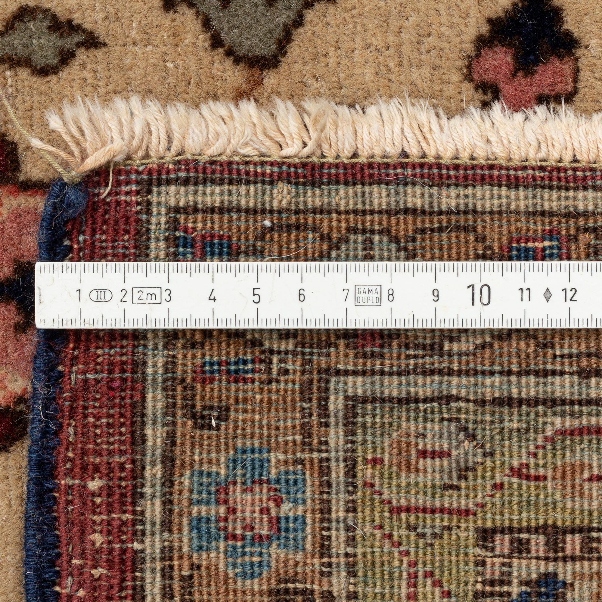 An antique Benlian Tabriz carpet, signed Jabarzade, ca 466 x 323 cm.