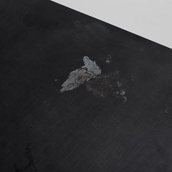 A modern square metal sofa table.