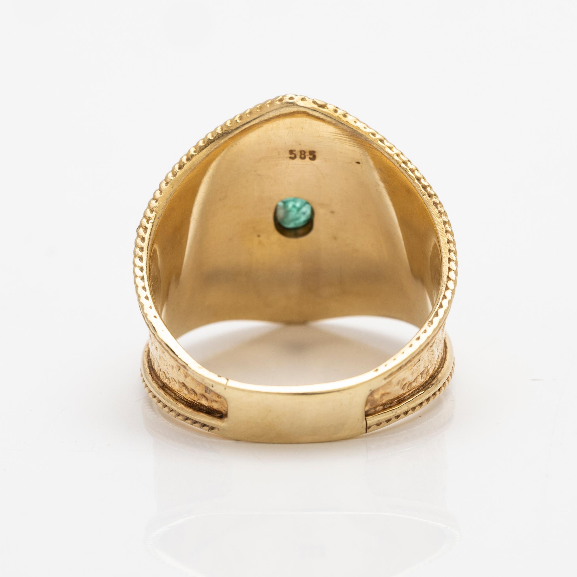 14K gold ring with an emerald.