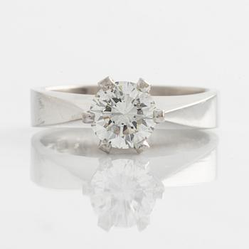 Ring solitaire with brilliant-cut diamond.