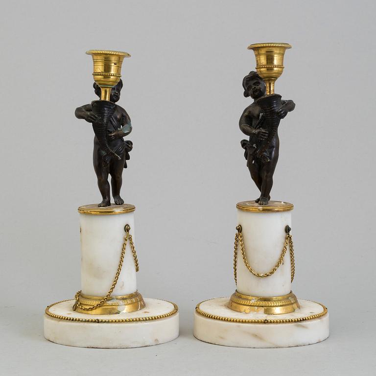 A pair of late gustavian candlesticks from around year 1800.