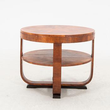 A stained wood table from the first half of the 20th century.