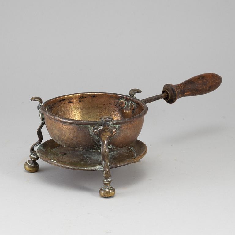 An 18th century brass brazier.