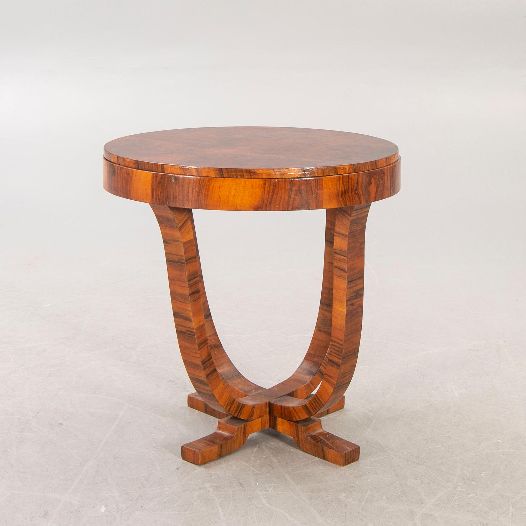 An Art Deco walnut coffee table first half of the 20th century.