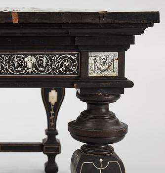 A Renaissance-style ebony, ebonized and ivory-inlaid library table, late 19th century, presumably Germany.