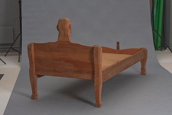 An Erik Höglund wooden bed, signed and dated 1969.