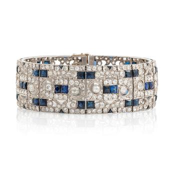 552. A platinum bracelet set with old-cut diamonds and step-cut sapphires.