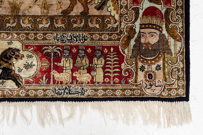 A pictorial semi-antique silk Qum rug, central Persia, c. 214 x 146 cm.