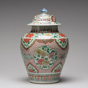 A Transitional wucai baluster vase with cover, 17th Century.