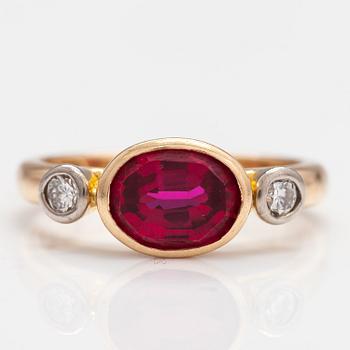 An 18K gold ring with a synthetic ruby and diamonds ca  0.22 ct in total. Lappi & K:ni, Lappeenranta 1925.