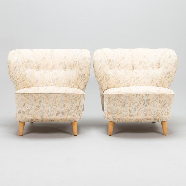 A pair of mid 20th century armchairs.