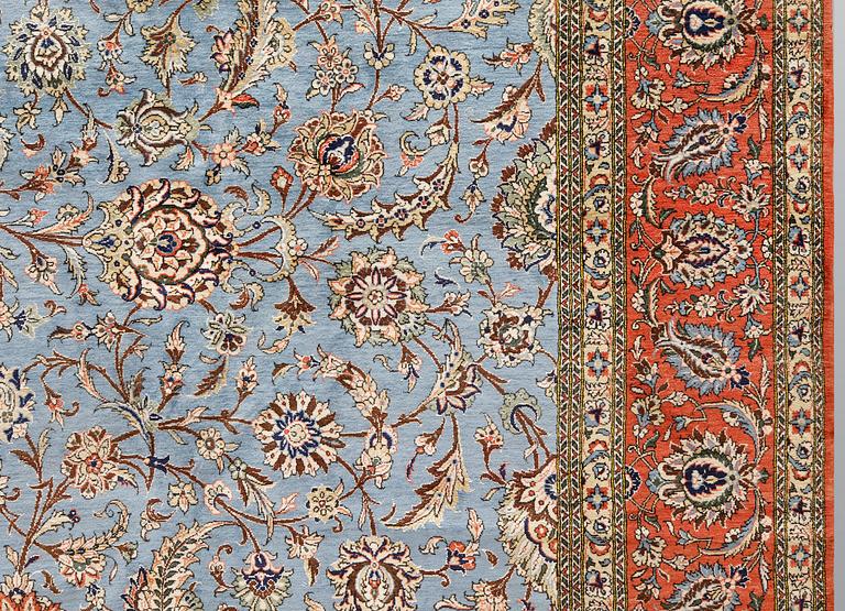 A Ghom carpet, part silk, approx. 480 x 350 cm.