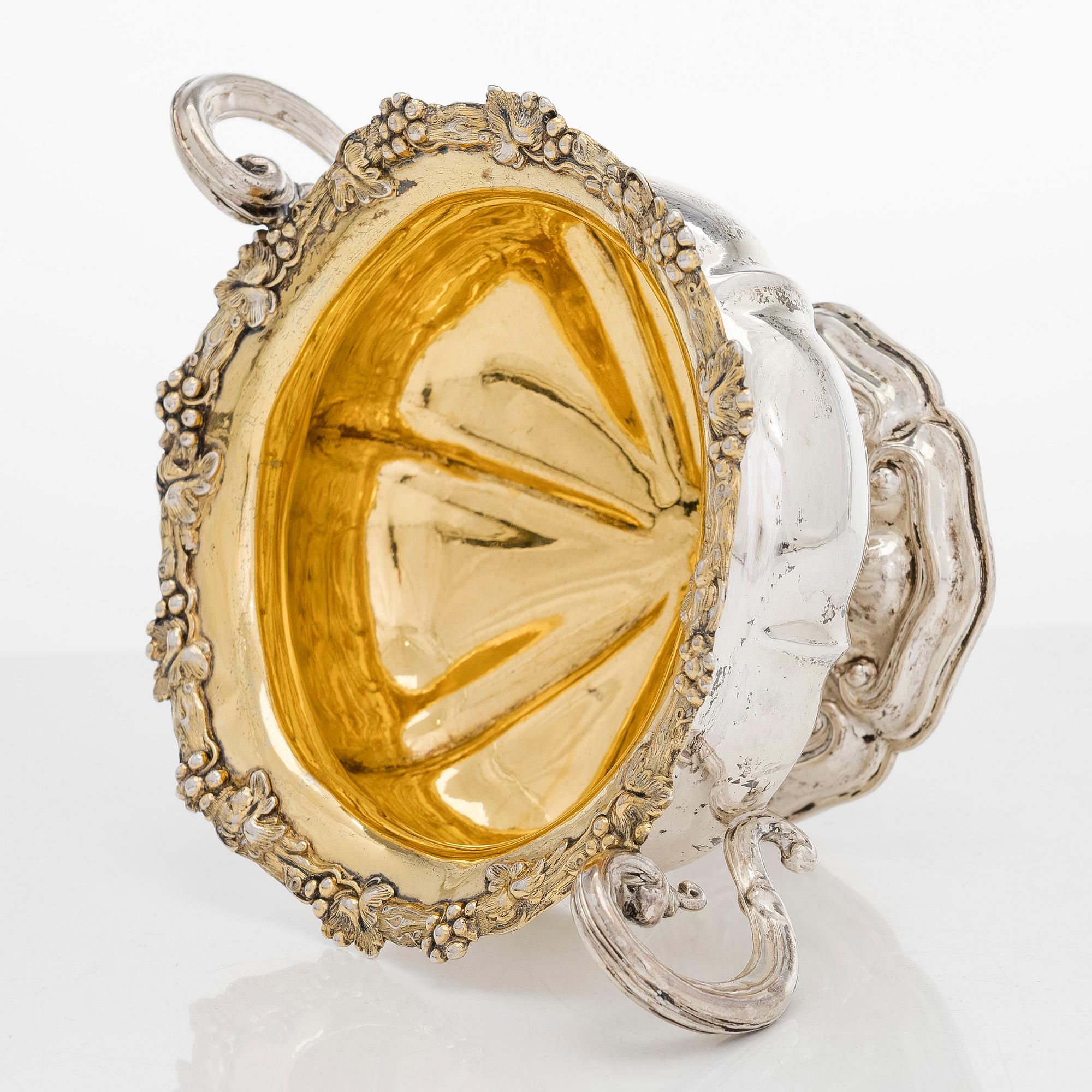 A silver sugar bowl, R. Mellin, Helsinki 1860, and two tea strainers, Kuopio and Porvoo, first half of the 19th century.