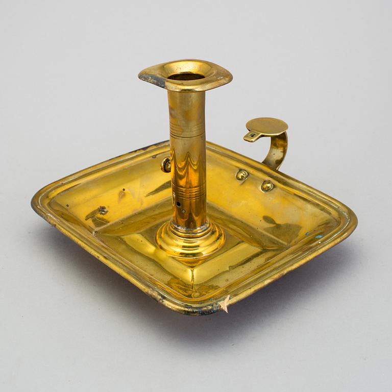 A 19th century brass candlestick.