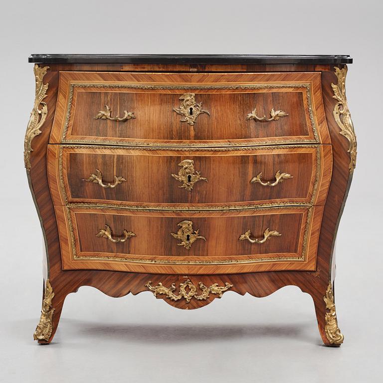 A rococo parquetry and gilt brass-mounted commode possibly by C. Åhman (master in Stockholm 1748-1783).