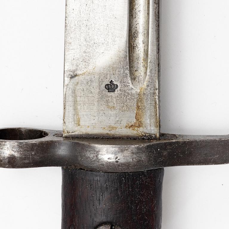 Three Swedish bayonets with scabbards.