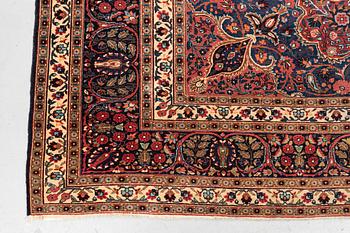 A carpet, semi-antique Mashad/Moud, ca 292 x 214 -218 cm.