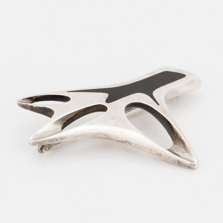 HENNING KOPPEL, a sterling silver and enamel brooch from Georg Jensen, Denmark.