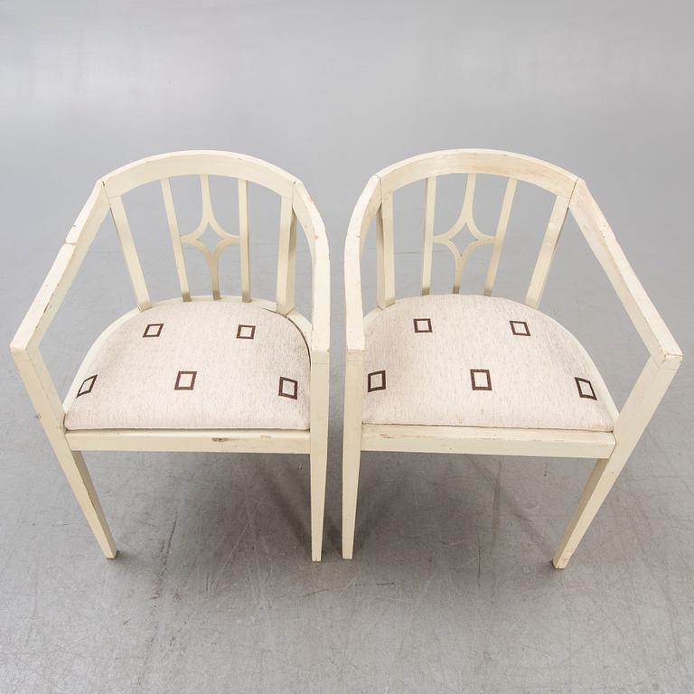 A pair of early 1900s armchairs.